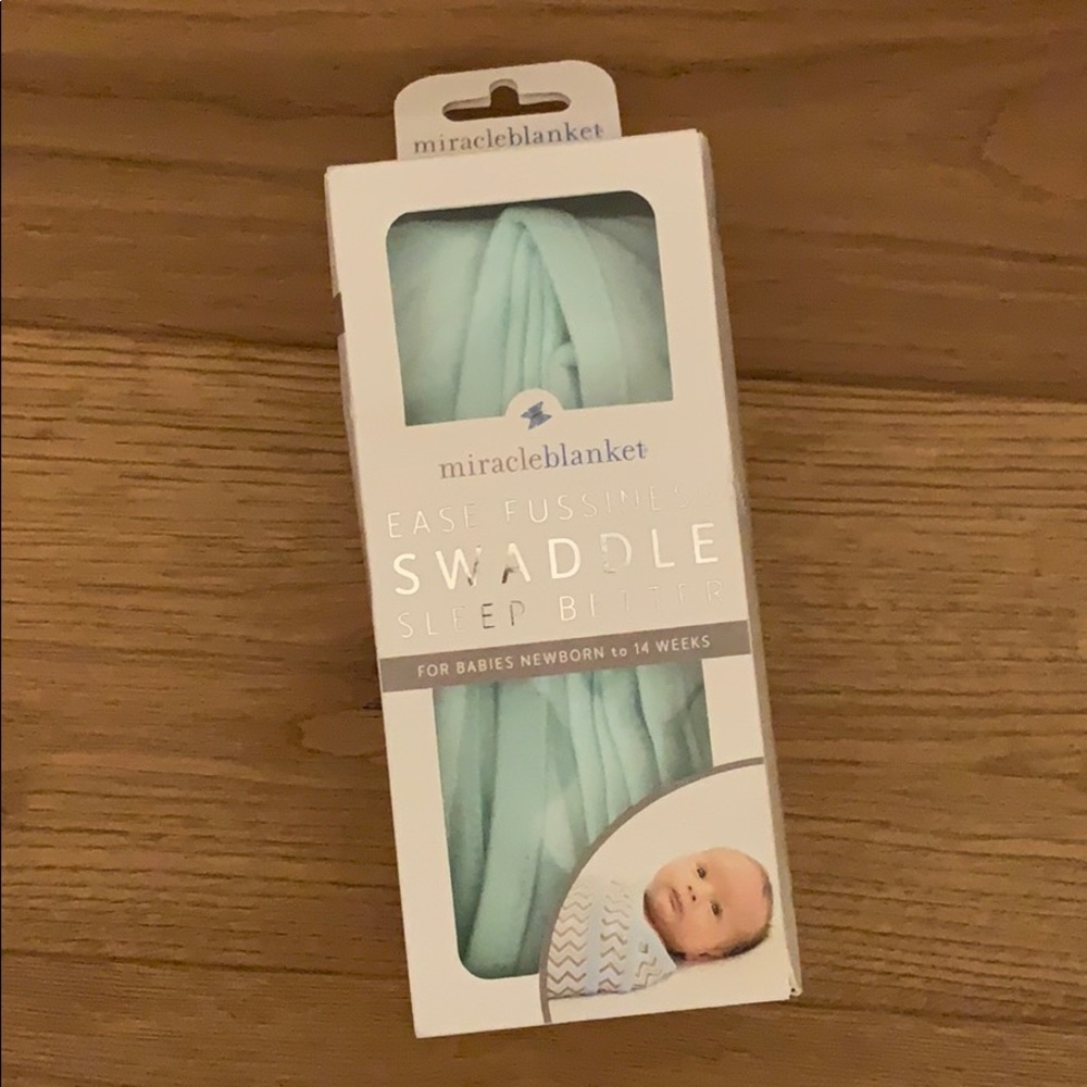 Miracle blanket swaddle, new in box.